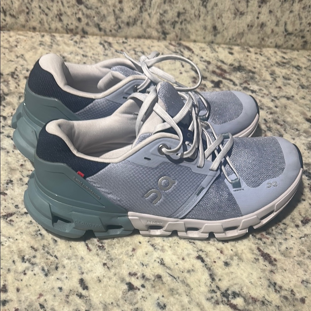 On Running Gray and Blue Sneakers with Cloud Cushioning